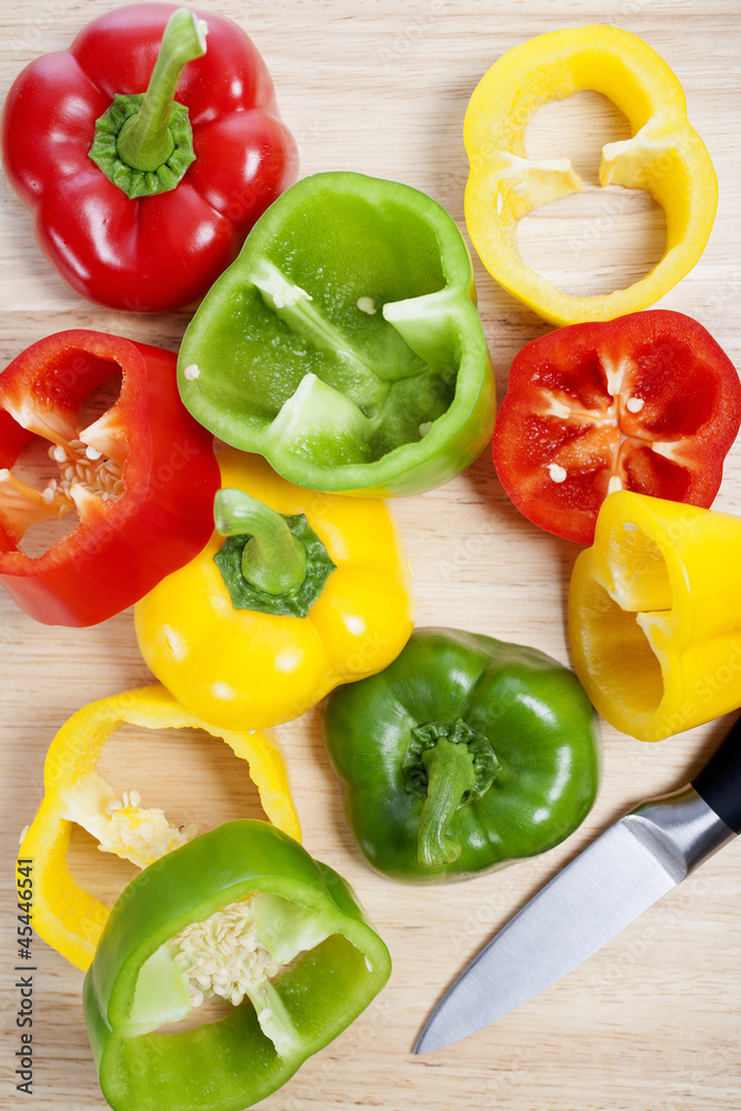 Mixed peppers on chopping board Mixed peppers on chopping board