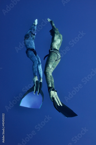 The romantic simultaneous freedive into the depth photo