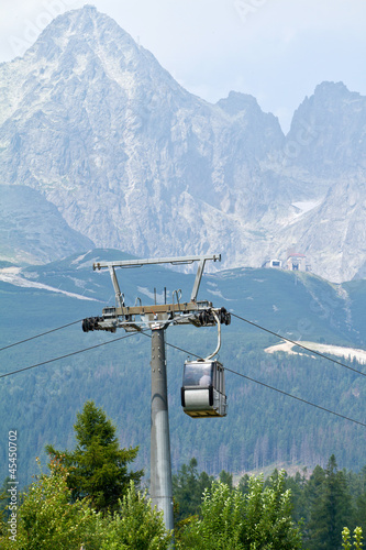 Cable car cabin against Lomnicky peak in High Tatras mountains,