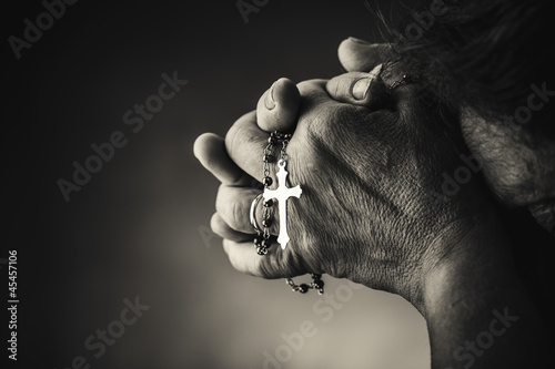Praying with a rosary photo