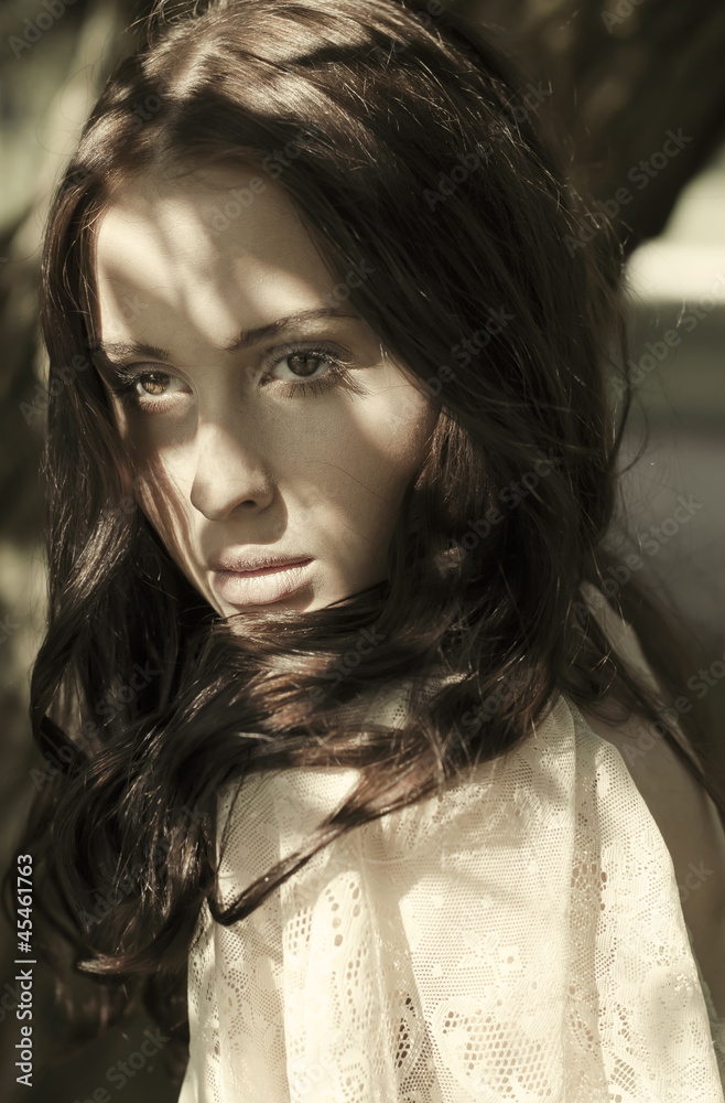 portrait of a beautiful brunette with sunspots