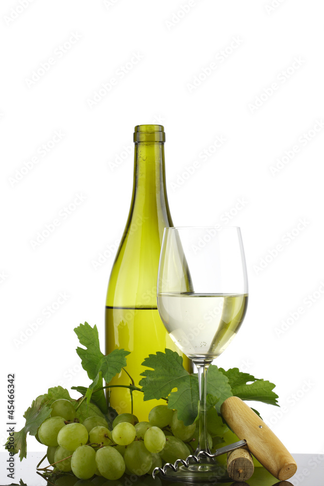 bottle with white wine and glass and grapes