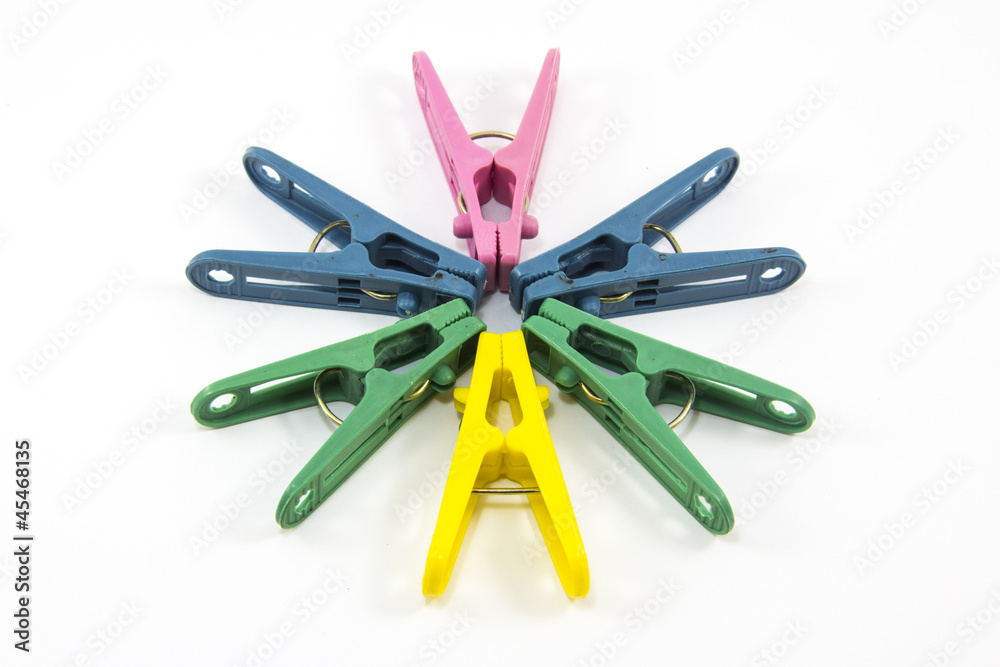 Plastic Clothes Pegs isolated on White Background Plastic Clothes Pegs isolated on White Background