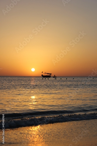 Fishing boat in beautiful sunrise © mcsm