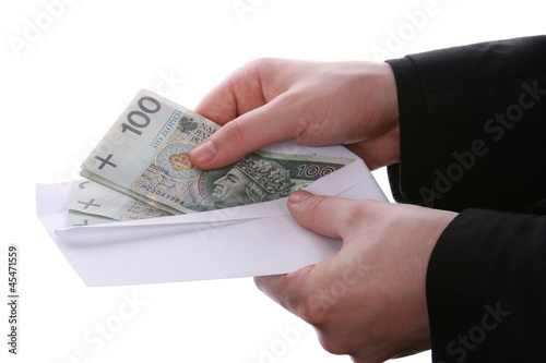 Businessman giving money in envelope