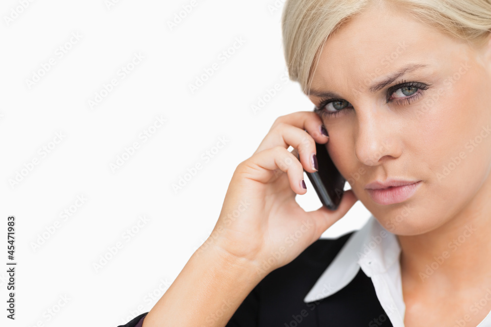 Attractive businesswoman using her mobile Attractive businesswoman using her mobile