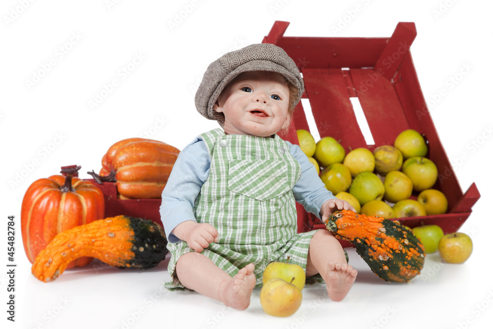 Fototapeta premium Baby Puppe mit Kürbise