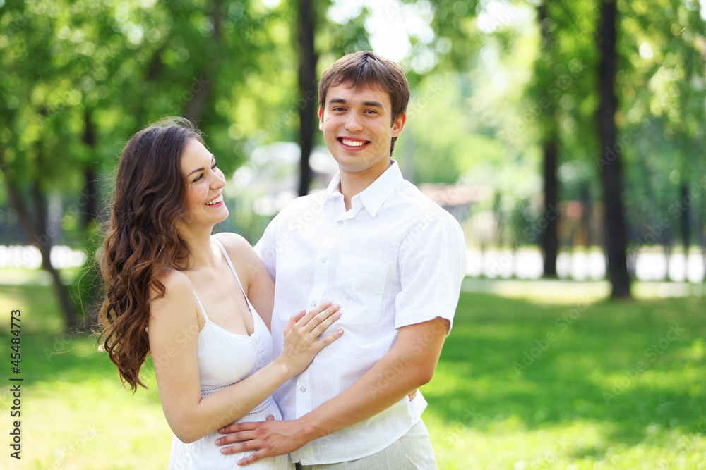 Young love Couple smiling under blue sky Young love Couple smiling under blue sky