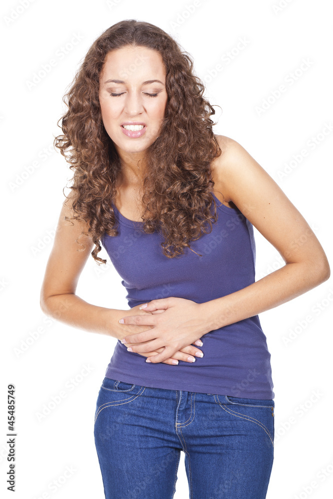 Young woman with stomach pains in studio... Young woman with stomach pains in studio...