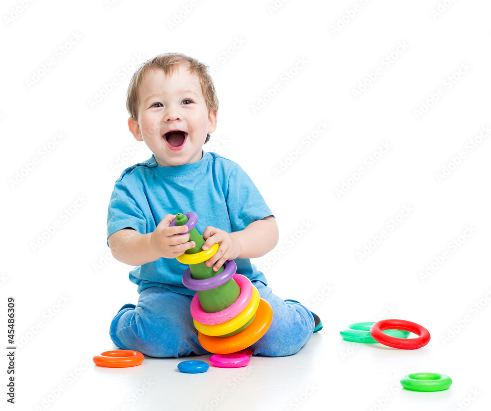 cheerful child playing with colorful toy isolated on white