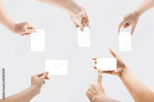 Collection of blank cards in a hand isolated