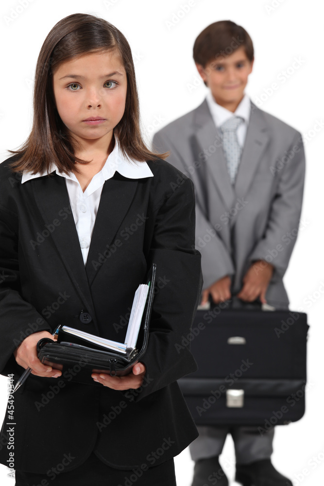 Little boy and girl dressed in business clothing Little boy and girl dressed in business clothing