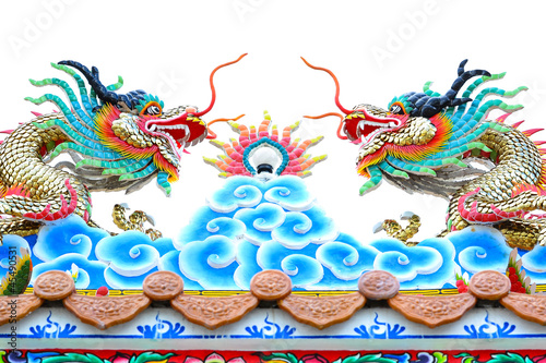 Colorful dragon decoration on temple roof isolated on white