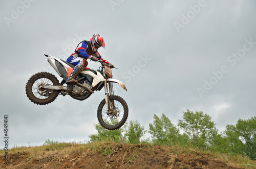 MX racer lands on the front wheel