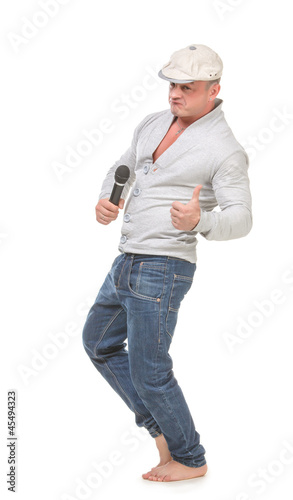 Man in a Cap with a Microphone shows Thumb-up