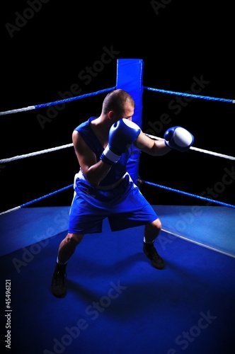Male boxer in ring doing exercise © cirkoglu