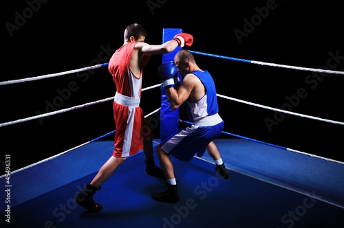 Two male boxers fighting in ring © cirkoglu