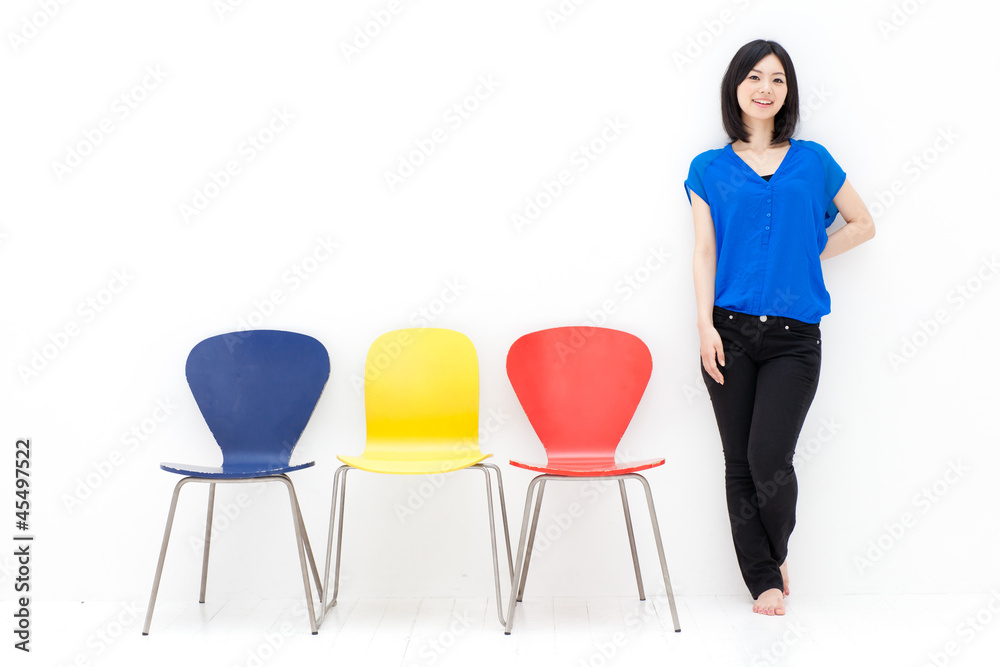 Fototapeta premium a young asian woman with colorful chair