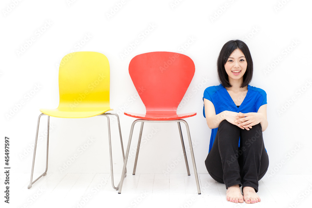 Fototapeta premium a young asian woman with colorful chair