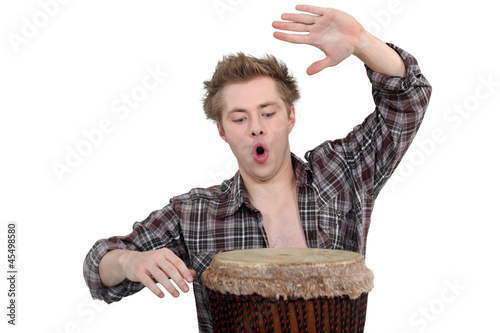 Photography Enthusiastic man playing the bongo drum