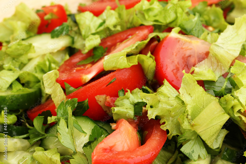 Fresh salad with tomatoes and cucumbers close-up Fresh salad with tomatoes and cucumbers close-up