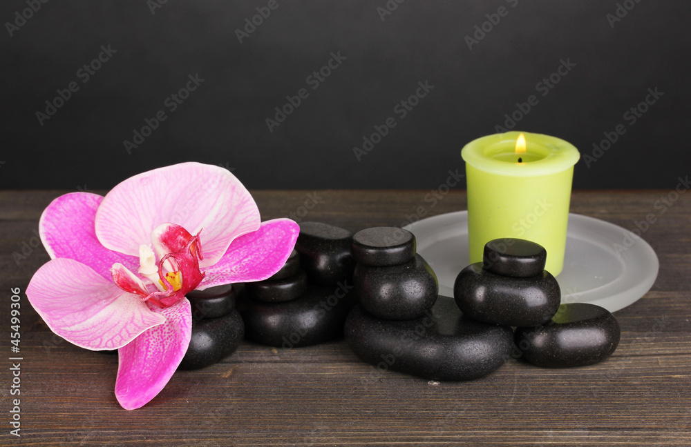 Spa stones with orchid flower and candle