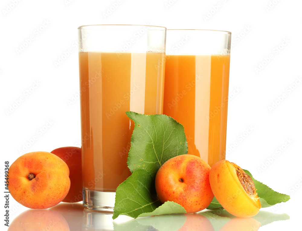 two glasses of apricot juice and apricots with leaves isolated two glasses of apricot juice and apricots with leaves isolated