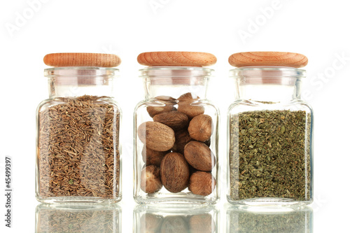Fototapeta Naklejka Na Ścianę i Meble -  powder spices in glass jars  isolated on white