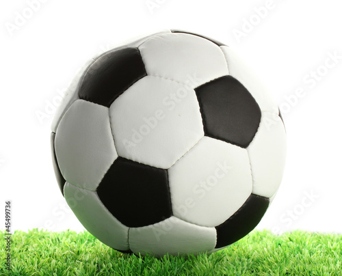football ball on green grass, isolated on white © Africa Studio
