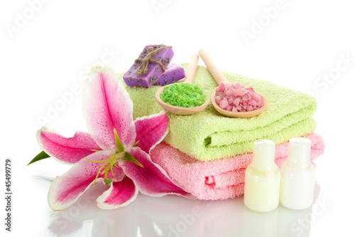 towels with lily  aroma oil  soap and sea salt isolated on