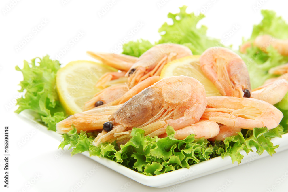 Boiled shrimps with lemon and lettuce leaves Boiled shrimps with lemon and lettuce leaves