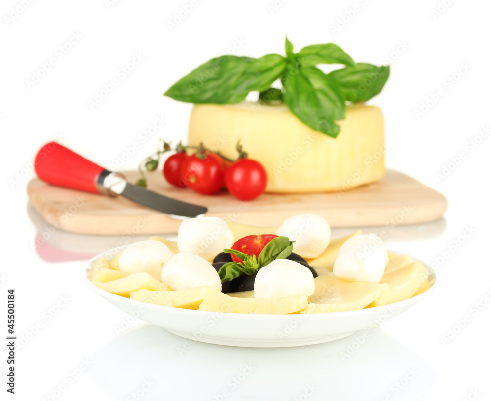 sliced mozzarella cheese with vegetables in the plate isolated sliced mozzarella cheese with vegetables in the plate isolated