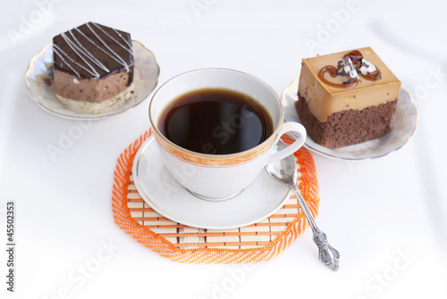 Black morning coffee and fresh sweet chocolate cake