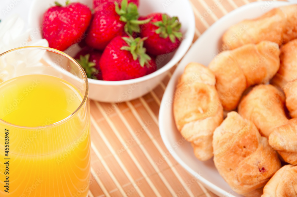 Breakfast with berries,orange juice and croissant Breakfast with berries,orange juice and croissant