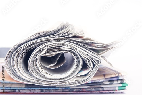 Stack of newspaper on white background