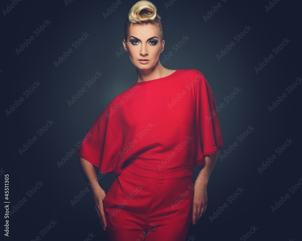 Naklejka premium Fashionable woman in red with creative hairstyle