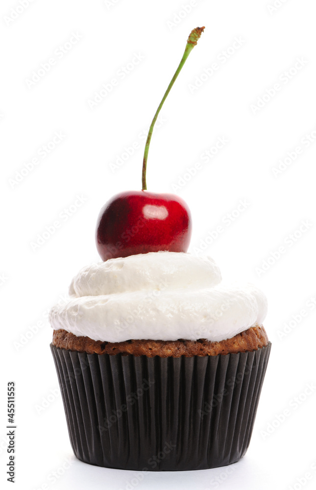 Cupcake with whipped cream and cherry