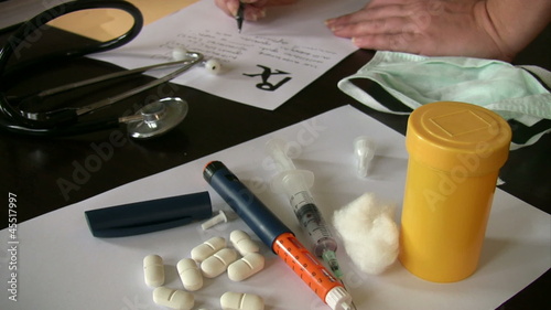 Female doctor writing prescription. photo