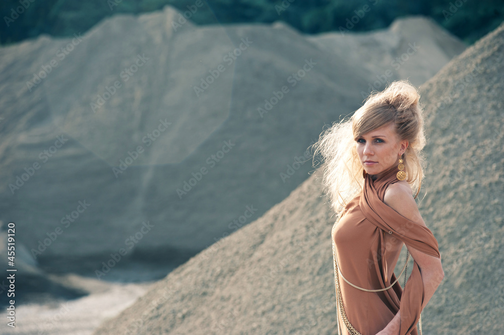 Young woman outdoors portrait in a quarry. Young woman outdoors portrait in a quarry.