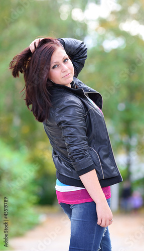 Portrait of sweet young woman enjoying at the park