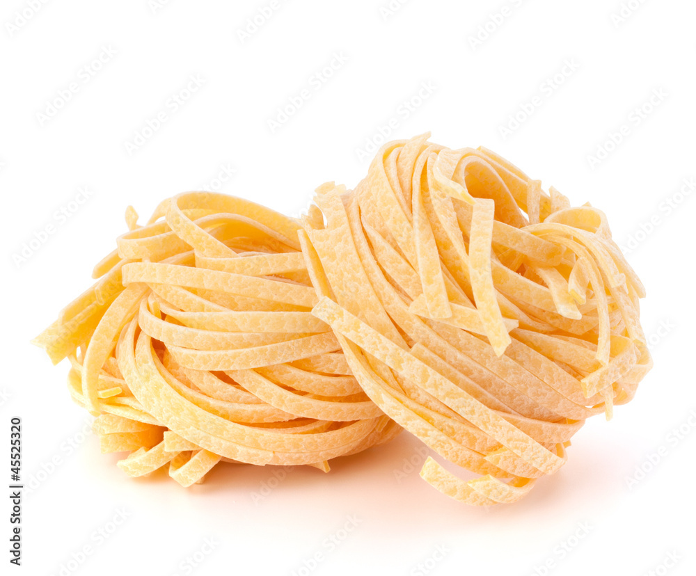 Italian pasta tagliatelle nest isolated on white background