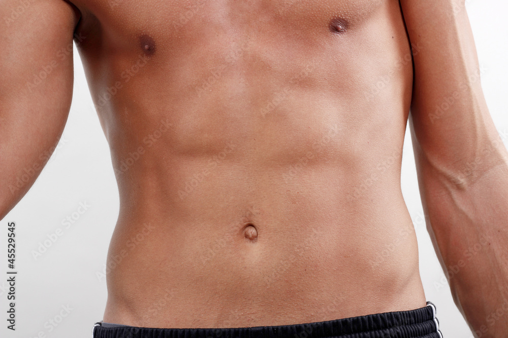 Fototapeta premium Mann mit Sixpack durch Training