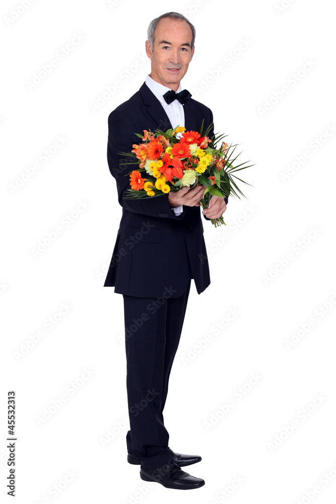 elegant senior man with a flowers bouquet elegant senior man with a flowers bouquet