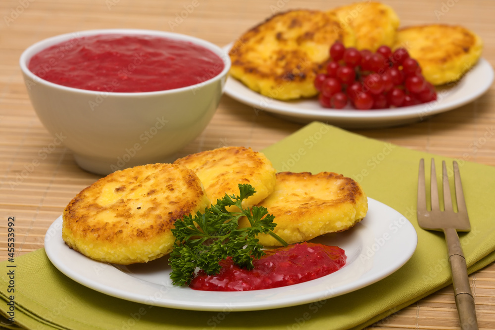 Sweet cheese pancakes on a plate Sweet cheese pancakes on a plate