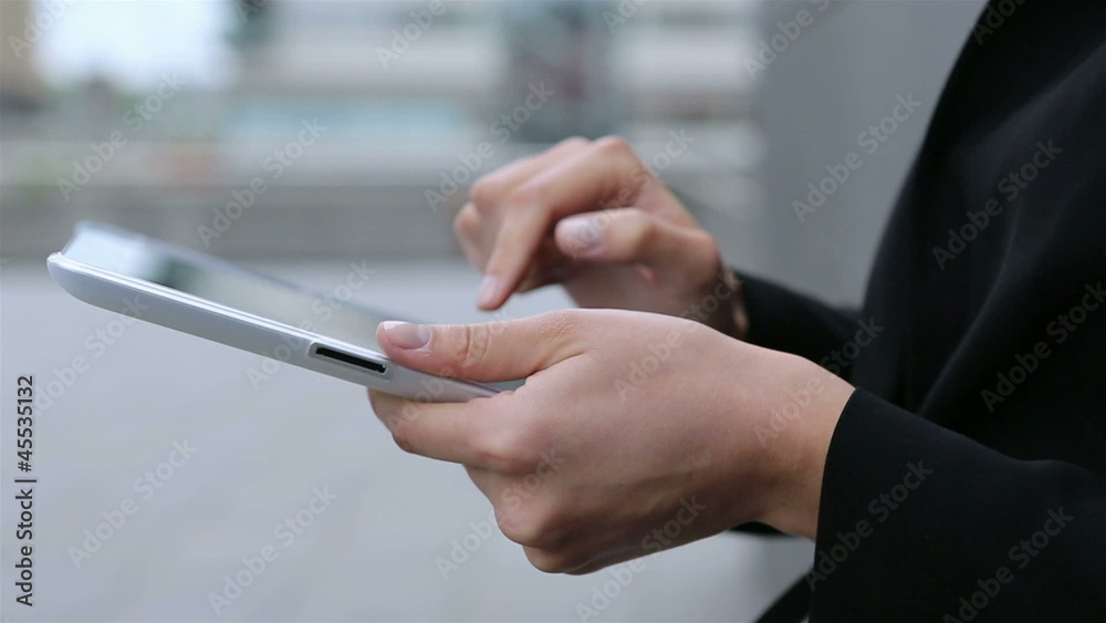 Hands using tablet computer