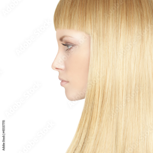 Beautiful woman with blond healthy hair - beauty salon backgroun