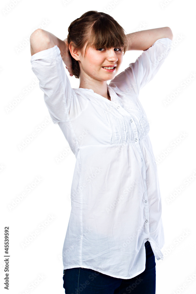 Young and funny girl in a white shirt and dark blue jeans Young and funny girl in a white shirt and dark blue jeans