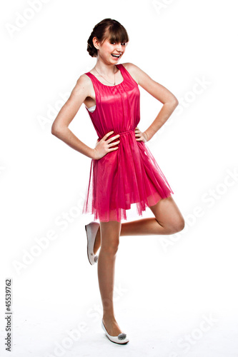 Young and funny girl in a red dress