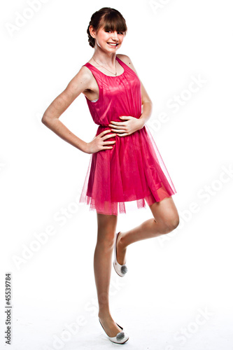 Young and funny girl in a red dress