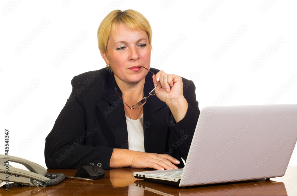 Mature businesswoman looking at the laptop screen Mature businesswoman looking at the laptop screen